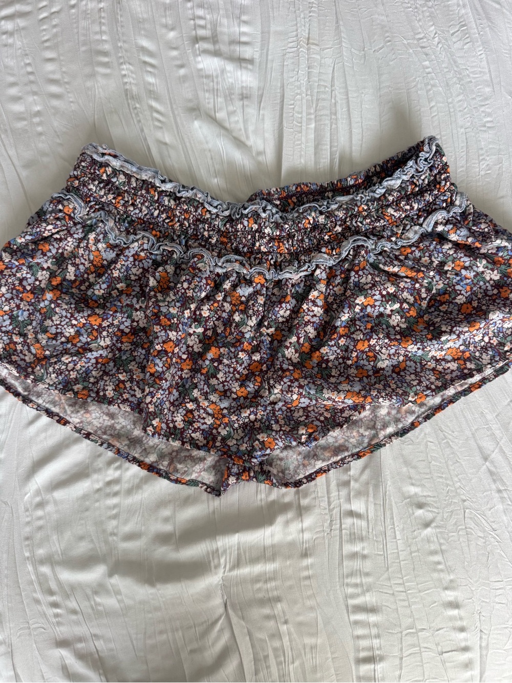 By Anthropologie Ditsy Floral Smocked Ruffle Lounge Shorts